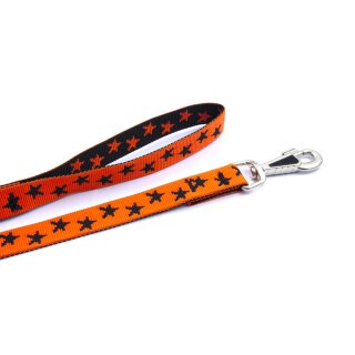 Orange mit schwarzen Sternen